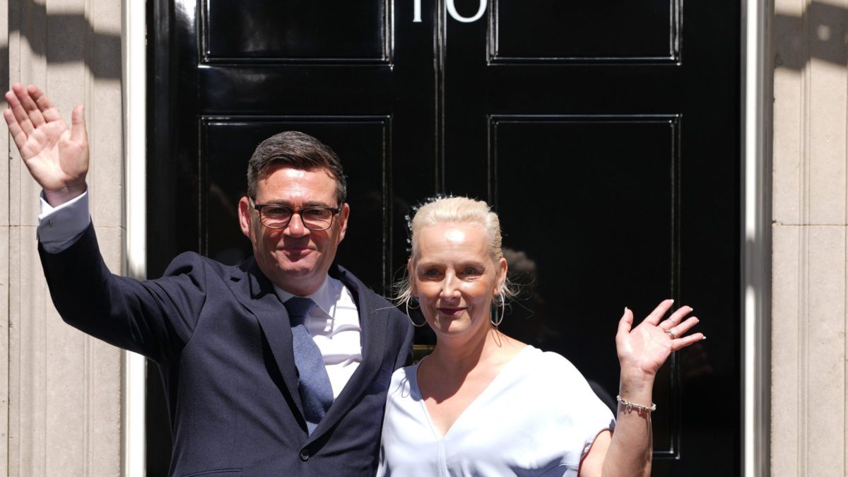 Britain's new Prime Minister Andy Burnham and his wife Marie-France van Heel wave as they arrive at 10 Downing Street in London, Monday, July 20, 2026.(AP Photo/Kirsty Wigglesworth)