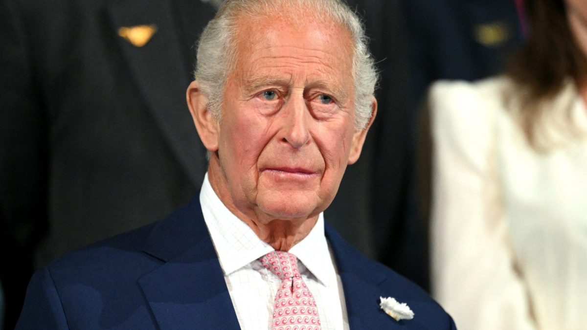 Britain's King Charles III stands for the national anthem during the opening ceremony of the 23rd Commonwealth Games at the OVO Arena in Glasgow, Scotland, on July 23, 2026. (Photo by Oli SCARFF / AFP via Getty Images)