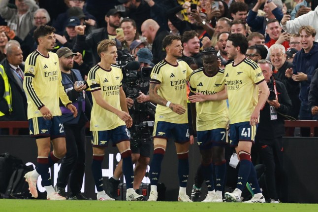 Arsenal's Bukayo Saka, 2nd right, celebrates with team mates after scoring his side's opening goal during the English Premier League soccer match between Aston Villa and Arsenal in Birmingham, England, Monday, Aug. 31, 2026. (AP Photo/Morgan Harlow)
