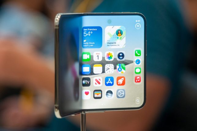 The new foldable iPhone Duo is displayed during an Apple event at the Steve Jobs Theater in Apple Park in Cupertino, California, on September 9, 2026. Apple unveiled its long-awaited first foldable smartphone, the iPhone Duo, on Wednesday, at the company's first launch event since CEO John Ternus took the reins on September 1. Apple's first foldable comes seven years after Samsung pioneered the category, but the American tech giant is expected to take a sizable chunk of the market. (Photo by Karl Mondon / AFP via Getty Images)