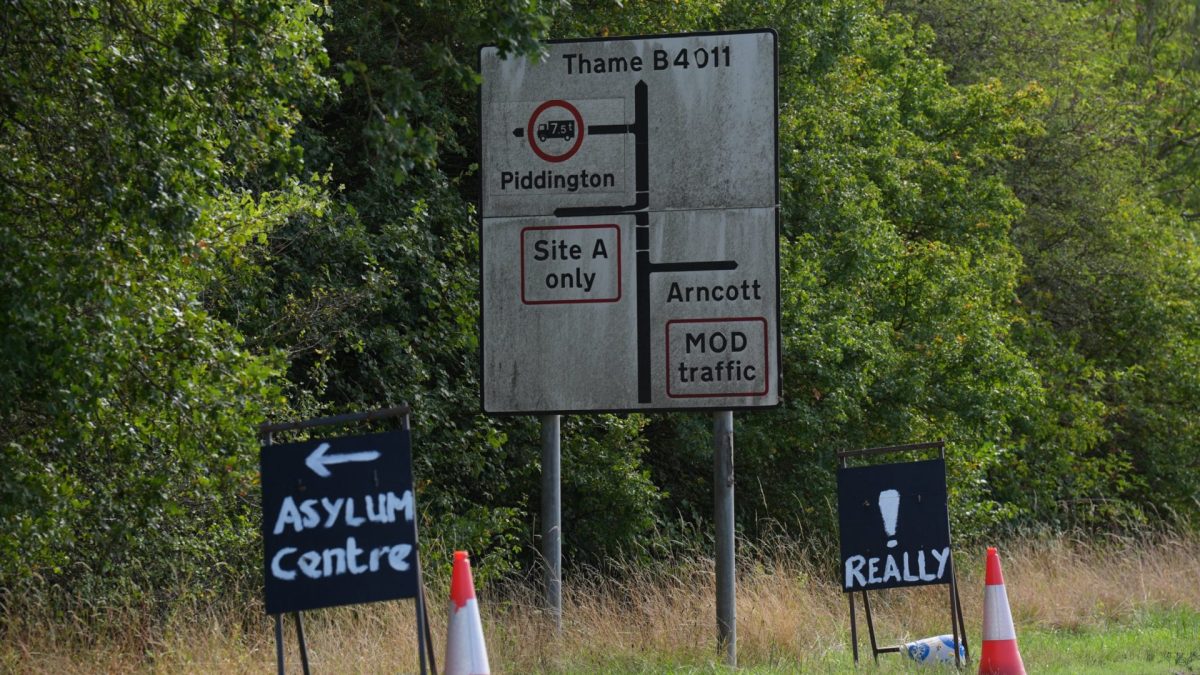 Protest signs near MoD Bicester in Oxfordshire where residents in nearby Piddington are due to hold a referendum on whether it should remain part of the UK after the Government said it wanted to set up a migrant camp at the former military base. The village of around 350 residents will hold the referendum on the Tuesday, with the results announced by the Parish Council at 7am on the Wednesday. Picture date: Monday September 14, 2026. PA Photo. Photo credit should read: Joe Giddens/PA Wire