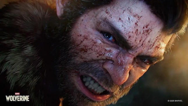 Wolverine snarling while his face has specks of blood across it