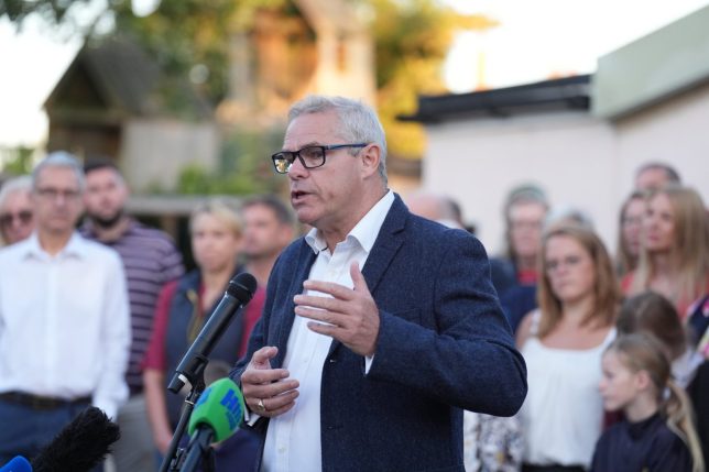 Chair of the Parish Council Tim McNally speaks with the media in Piddington, Oxfordshire, where local residents have held a symbolic 