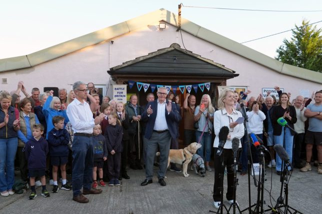 Returning officer Susannah Parden announces the result of a symbolic ?referendum? in the village of Piddington, Oxfordshire, where local residents voted overwhelmingly to become an independent state. The village of around 350 residents held the vote after the Government said it wanted to set up a migrant camp close by. Picture date: Wednesday September 16, 2026. PA Photo. Photo credit should read: Joe Giddens/PA Wire