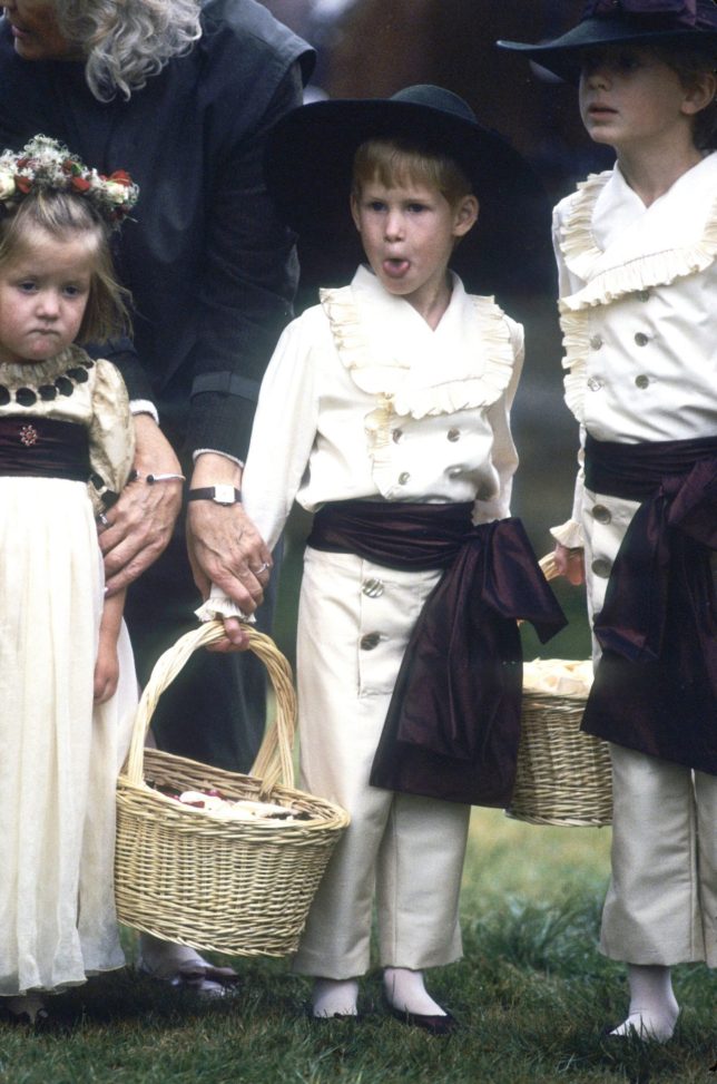 ALTHORP, UNITED KINGDOM - SEPTEMBER 17: Cheeky Prince Harry sticks out his tongue as he stands with his cousins Eleanor Fellowes and Alexander Fellowes when he acts as a pageboy at the wedding of his uncle Charles Spencer (Viscount Althorp) on September 17, 1989 in Althorp, England. (Photo by Anwar Hussein/Getty Images)