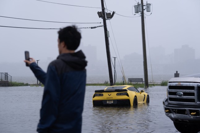 EDGEWATER, NEW JERSEY, USA - SEPTEMBER 27: A vehicle is seen submerged in floodwaters in a parking lot along the Hudson River during a nor'easter storm in Edgewater, New Jersey, United States, on September 27, 2026. Heavy rain and strong winds battered the northeastern United States as an unusually powerful autumn storm intensified, forcing the cancellation of hundreds of flights and leaving tens of thousands of people without power. New York, Boston and Philadelphia were among the areas affected by the storm, as authorities warned of potential major flooding and road closures. (Photo by Lokman Vural Elibol/Anadolu via Getty Images)