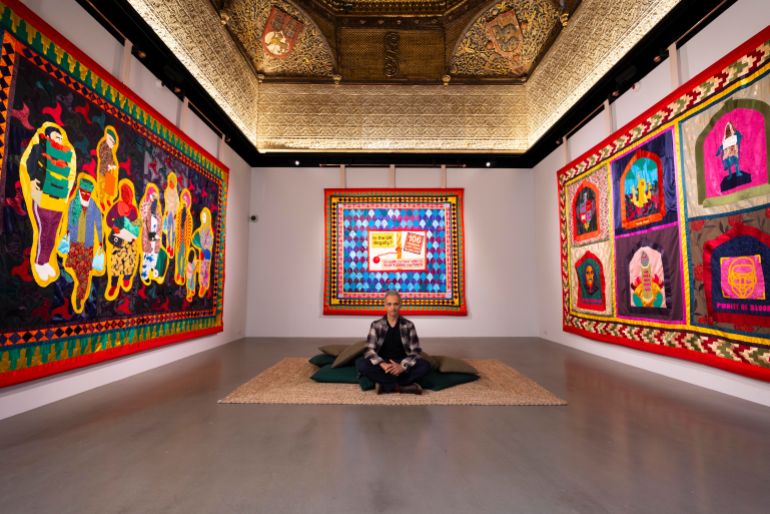 Shahed Saleem, an artist, architect and academic, sits under the Islamic-inspired Spanish roof which originated from the central Spanish town of Torrijos [Courtesy of David Parry]