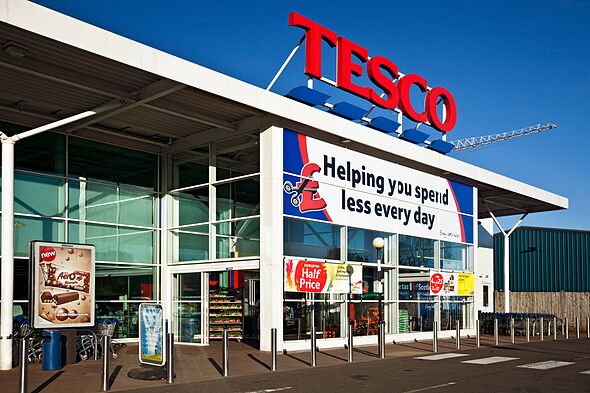 Kilbirnie, Scotland, UK - 1st May, 2011: The main entrance to a Tesco Superstore in North Ayrshire. There is a slogan banner and Kilbirnie, Scotland, UK - 1st May, 2011: The main entrance to a Tesco Superstore in North Ayrshire. There is a slogan banner and