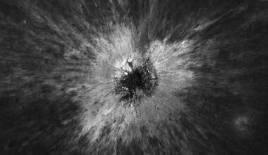 A black and white image of a crater on a gray surface