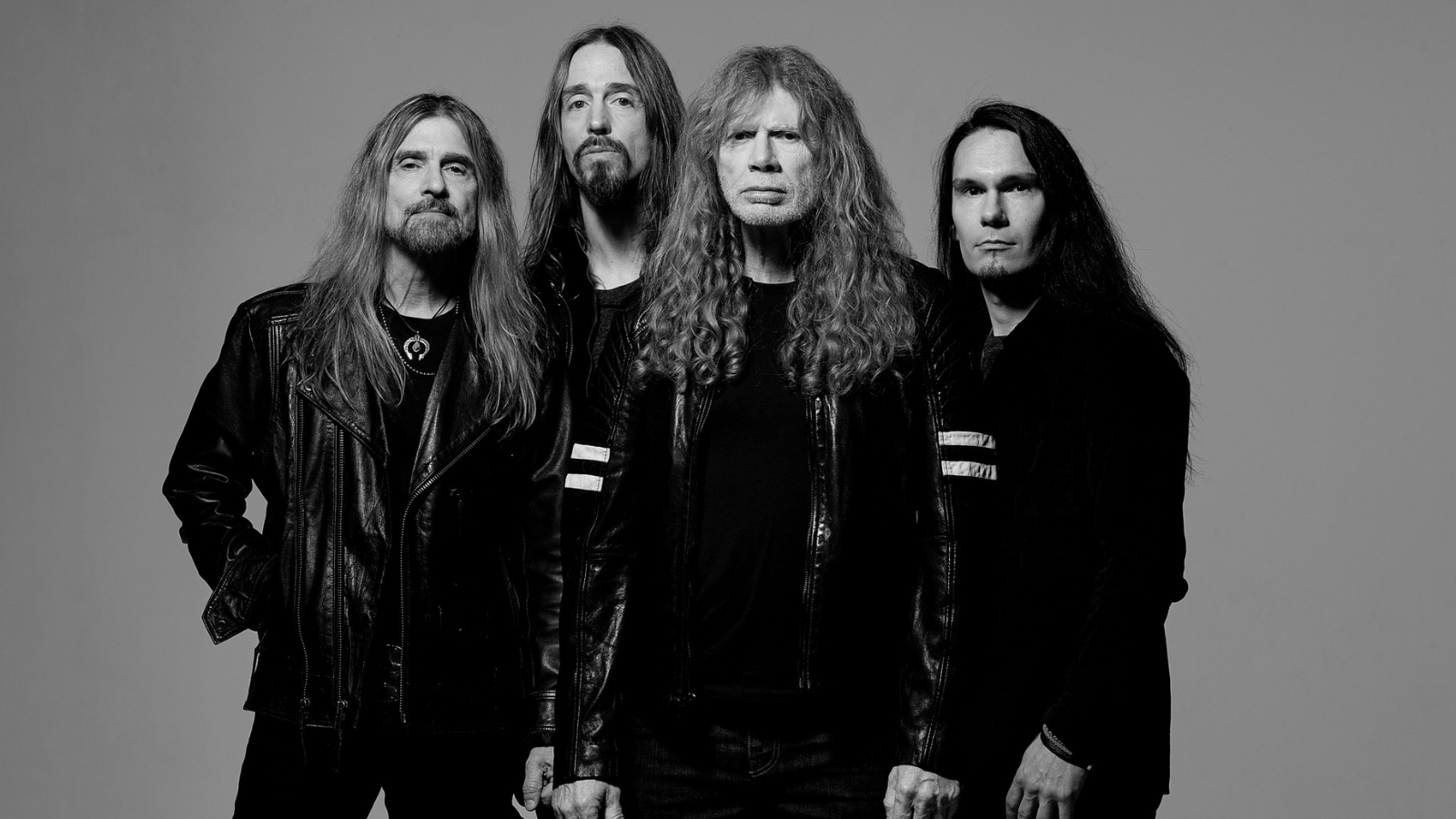 Megadeth posing for a photograph in 2025
