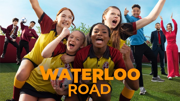 Waterloo Road S17 Key Art Tonya, Portia, Shola and Cat jump onto one another in celebration in football kits, supported in the background by Ben, Ashton, Donte, Darius and Nisha. The orange Waterloo Road logo is in the centre of the image.