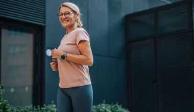 Woman wearing glasses and activewear, smiling