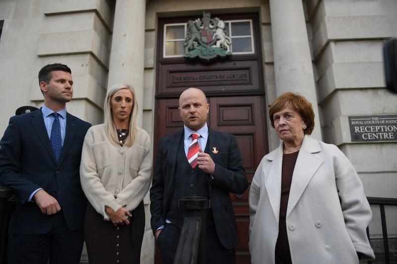 Loyalist activist Jamie Bryson (centre) with DUP representatives Jonathan Buckley, Carla Lockhart and Diane Dodds outside court after the ruling. Photograph: Charles McQuillan/Getty Images