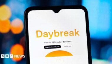 The word Daybreak in orange against a white phone background. Below it says Frontier AI for cyber defenders.
