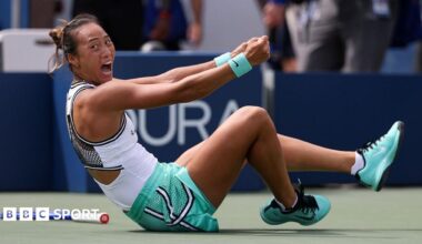 Qinwen Zheng falls to the ground in celebration after beating Madison Keys