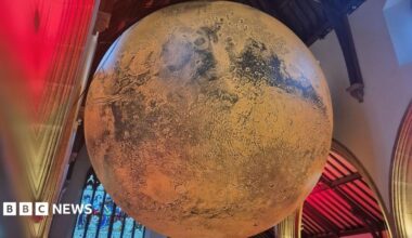 A large illuminated picture of mars sits in Peel Cathedral