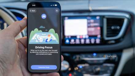 Do Not Disturb While Driving Focus mode shown on an iPhone 17 Pro with Android Auto in the background.