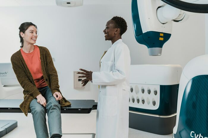 A female doctor talking with a patient, highlighting evolving medical practices
