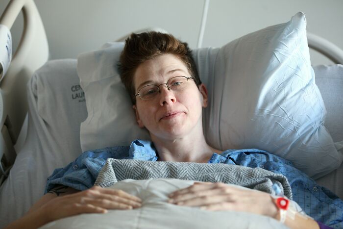 Patient in a hospital bed recovering after undergoing various medical practices