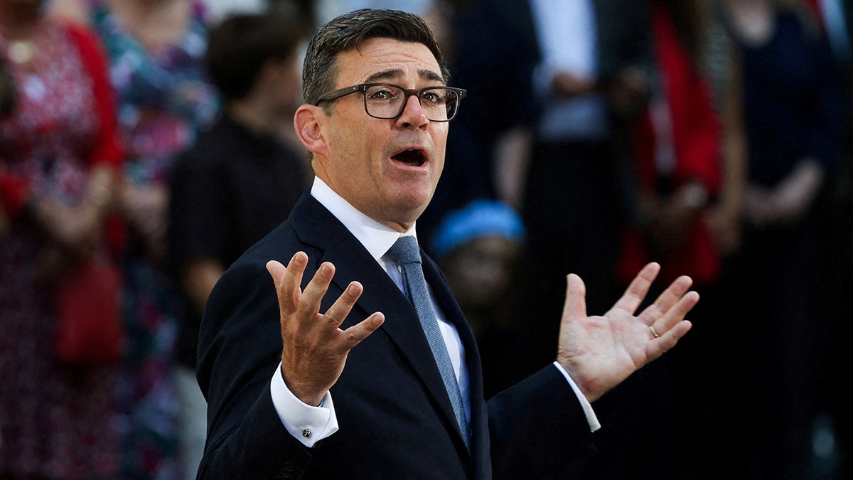 Prime Minister Andy Burnham delivers a speech.