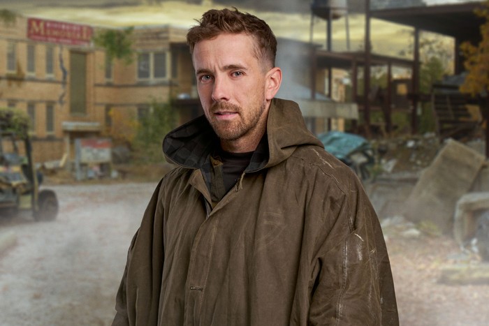 apocalypse-channel-4 A man stood slightly to one side wearing a brown rain cover.
