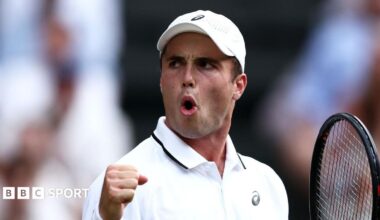 Arthur Fery reacts to winning a point at Wimbledon