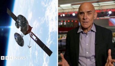 Satellite hovering over the blue planet Earth and Jonathan Beale