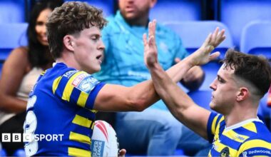 Arron Lindop of Warrington Wolves celebrates a try