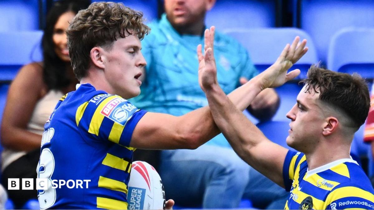 Arron Lindop of Warrington Wolves celebrates a try