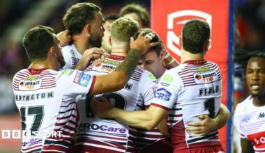 Wigan Warriors celebrate Harry Smith's try against Catalans Dragons