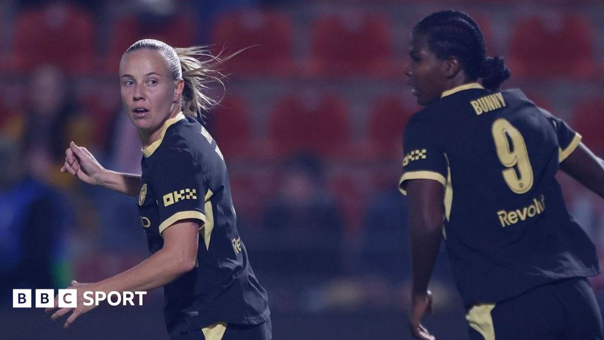 Beth Mead and Khadija Shaw in action for Manchester City, wearing black kit with yellow trim