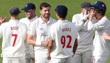 Glamorgan players celebrate a wicket against Surrey
