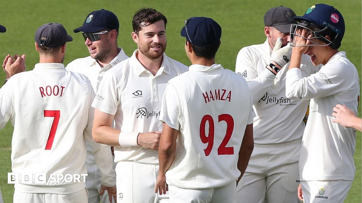Glamorgan players celebrate a wicket against Surrey