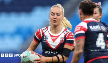 Jasmin Strange runs with a rugby ball