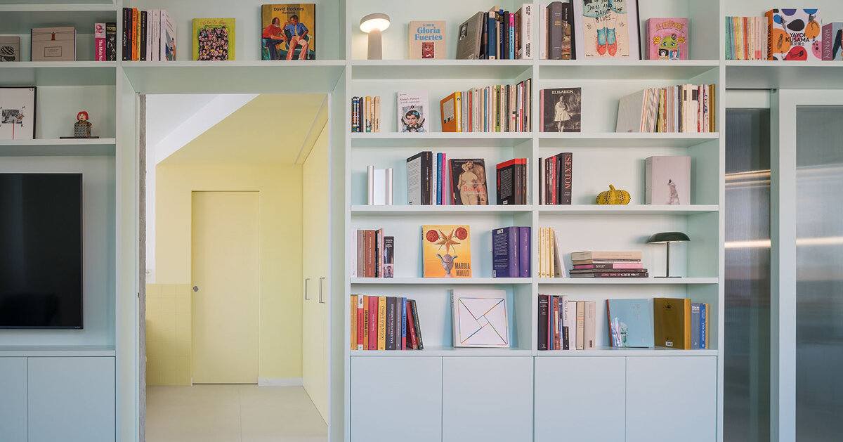 colored rooms and continuous bookcase reshape a madrid apartment