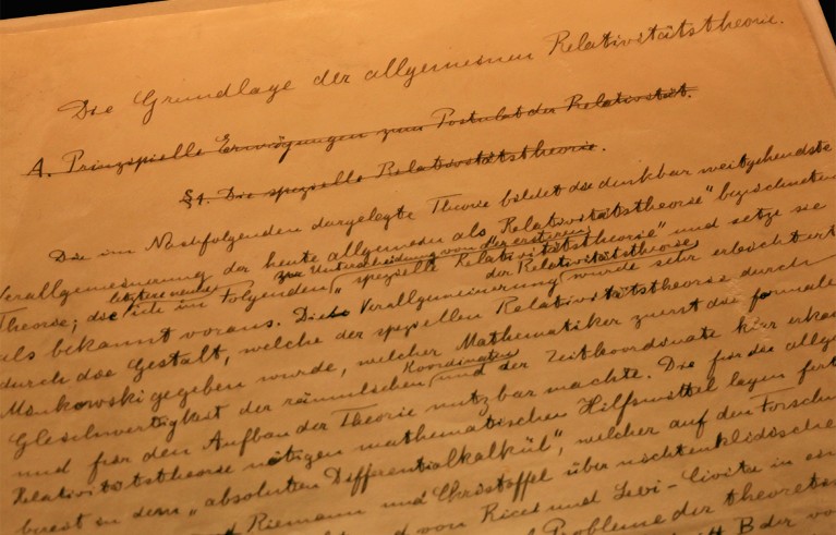 A handwritten manuscript page from Albert Einstein's General Theory of Relativity, featuring cursive German text on yellowed paper.