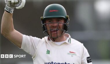 Ben Cox raises his arm in celebration