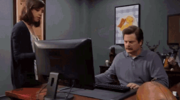 Ron Swanson throwing his PC in a dumpster