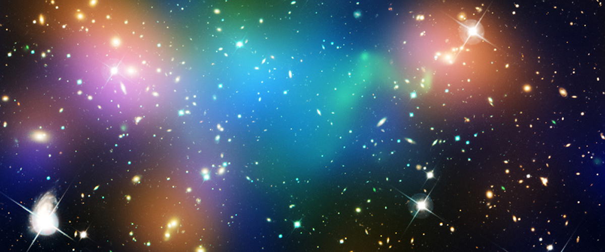 Hubble and Chandra X-ray Observatory image showing dark matter and hot gas in merging galaxy cluster Abell 520. Green is hot gas; blue areas are the location of most of the mass in the cluster, which is dominated by dark matter. NASA, ESA, CFHT, CXO, M.J. Jee (University of California, Davis), and A. Mahdavi (San Francisco State University).