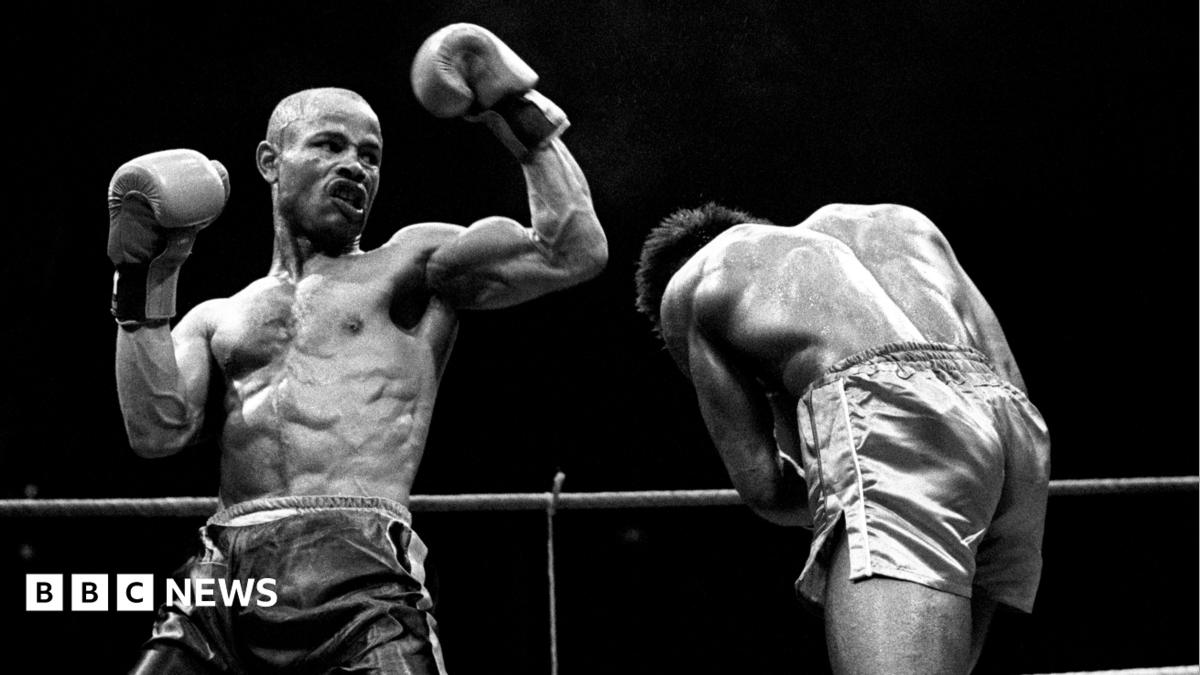 Tony Laing, left, on his way to victory over Clinton McKenzie of Croydon at the Royal Albert Hall in London