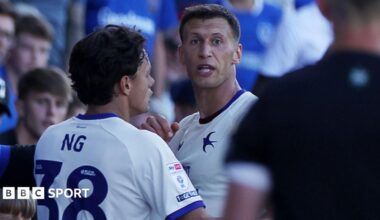 Krystian Bielik and Perry Ng, both in white and blue Cardiff City shirts, react at Portsmouth