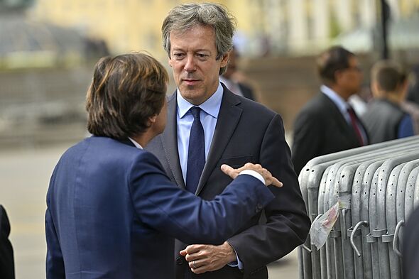 ritish Ambassador to Russia Nigel Casey (R) and French Ambassador to Russia Nicolas de Riviere (L) converse as they attend a flower-laying ceremony at