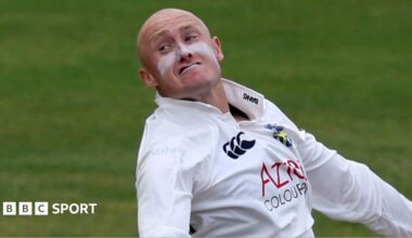 Callum Parkinson bowling with a grimace on his face