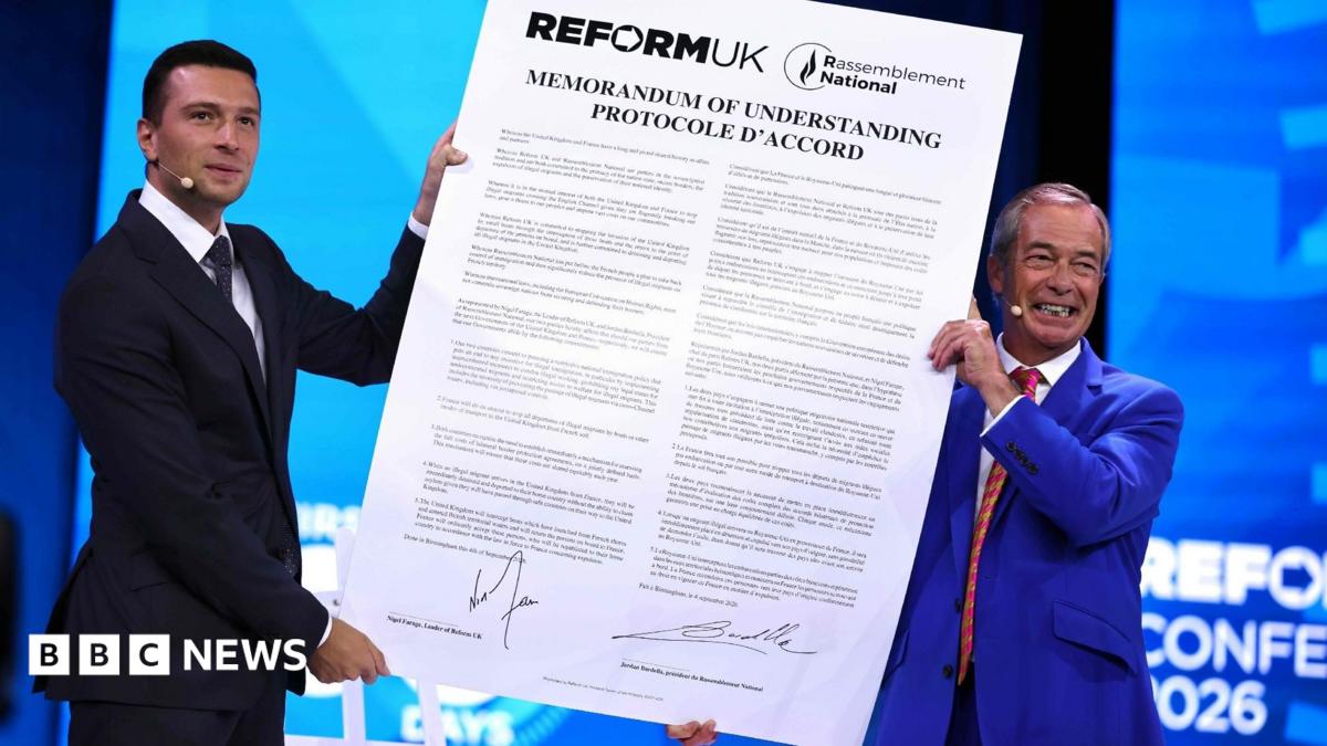 Reform UK leader Nigel Farage and National Rally President Jordan Bardella hold a large version of the proposed agreement