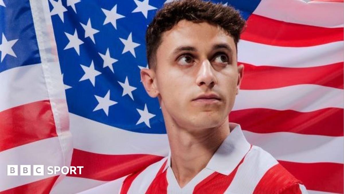 American Luca Bombino poses in front of the star spangled banner