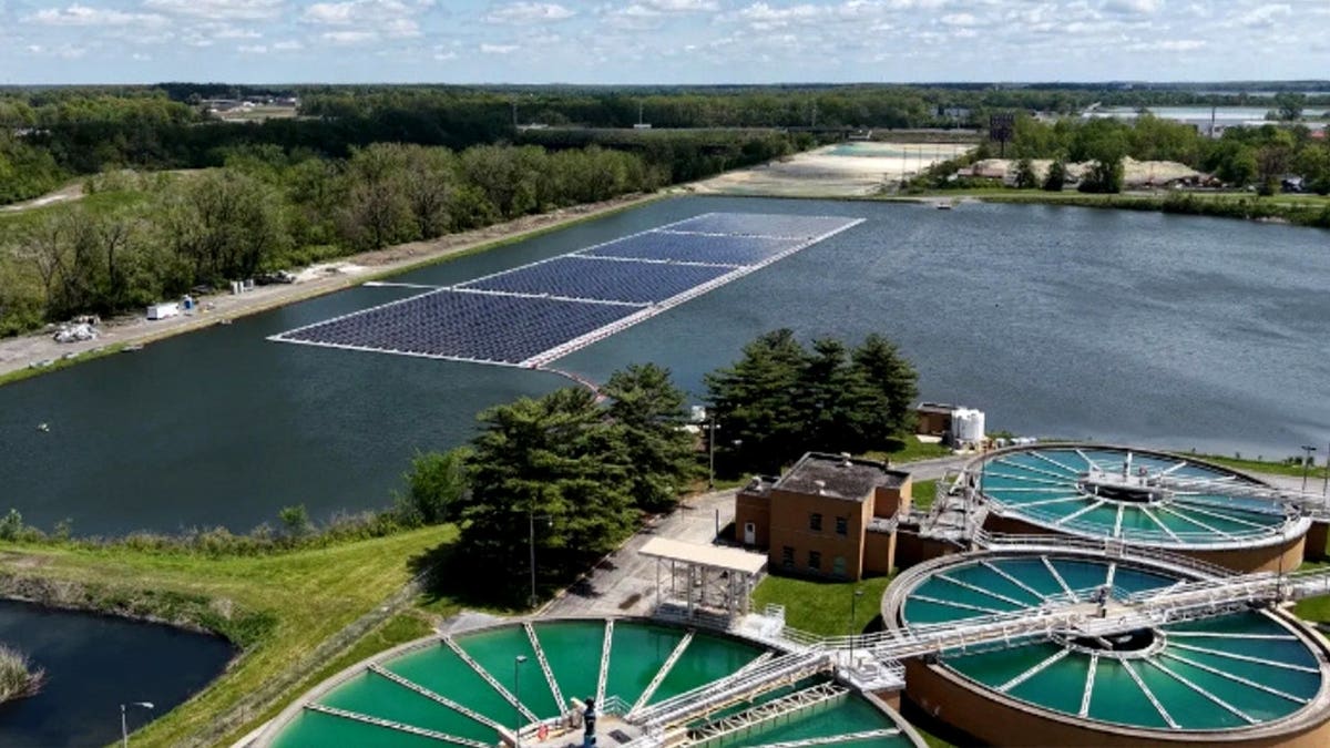 Floating solar panels are pictured on a reservoir.