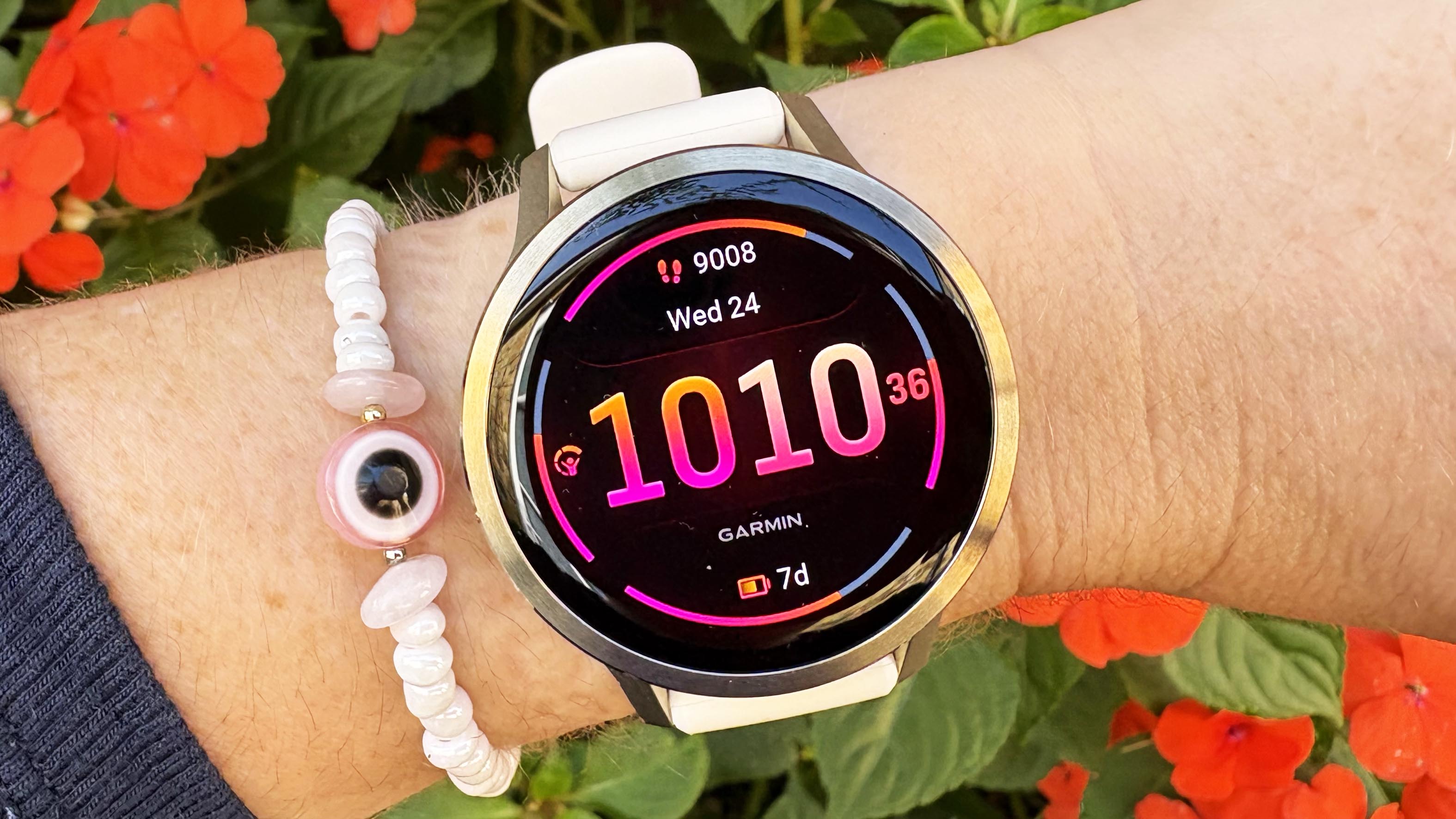 the Garmin Venu 4 in lunar gold on the wrist
