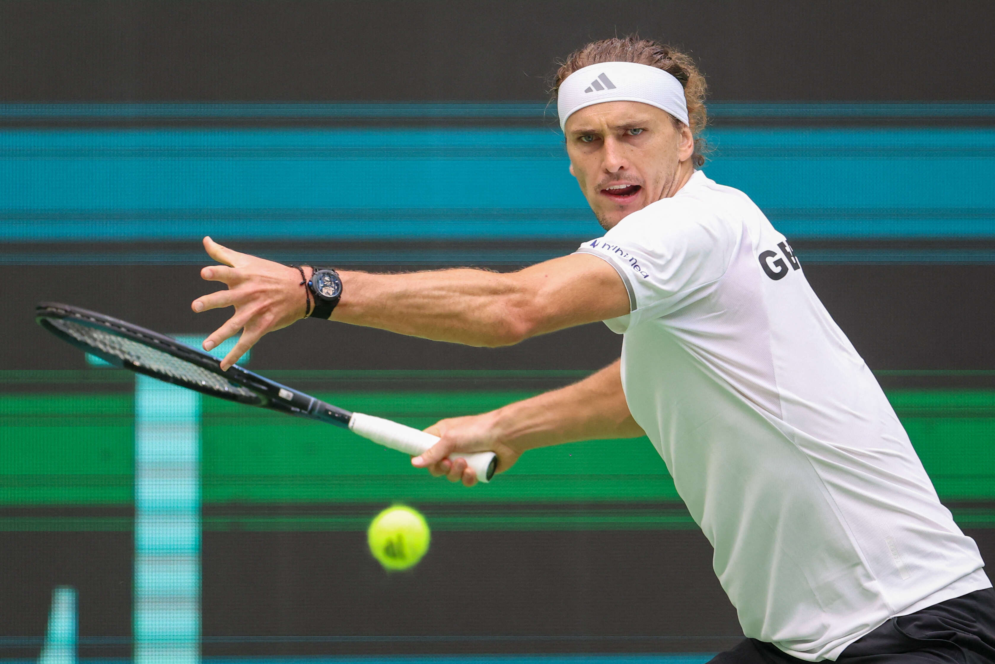 Germany's Alexander Zverev hits a ball during his match against Croatia's Dino Prizmic during their Davis Cup second qualifying round tennis match in Halle, Germany, Sunday, Sept. 20, 2026. (Christoph Reichwein/dpa via AP) Germany Croatia Davis Cup Tennis
