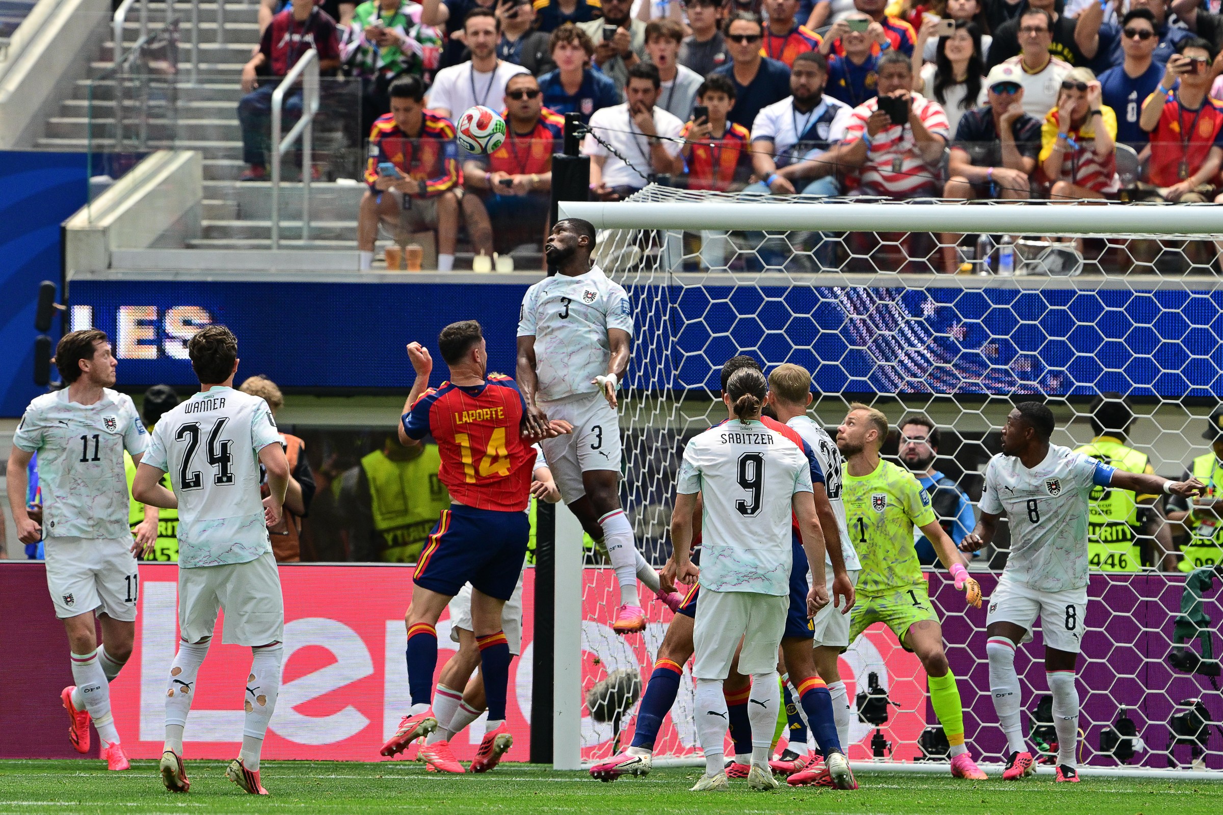 Spain’s defender #14 Aymeric Laporte and Austria’s defender #03 Kevin Danso jump for the ball during the 2026 World Cup round of 32 football match between Spain and Austria at the Los Angeles Stadium in Inglewood on July 2, 2026. (Photo by Frederic J. Brown / AFP via Getty Images)