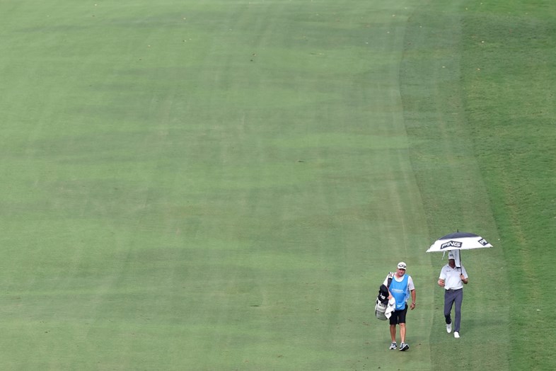 The PGA Tour star's caddie appeared out of options after being banned from the UK. But then Donald Trump has got involved...